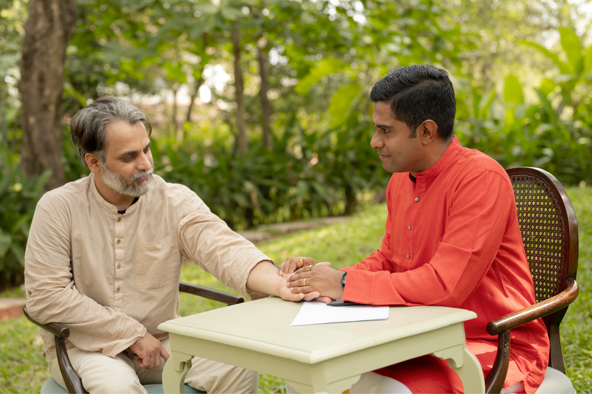 Dr. Vignesh Devraj speaking with retreat guests