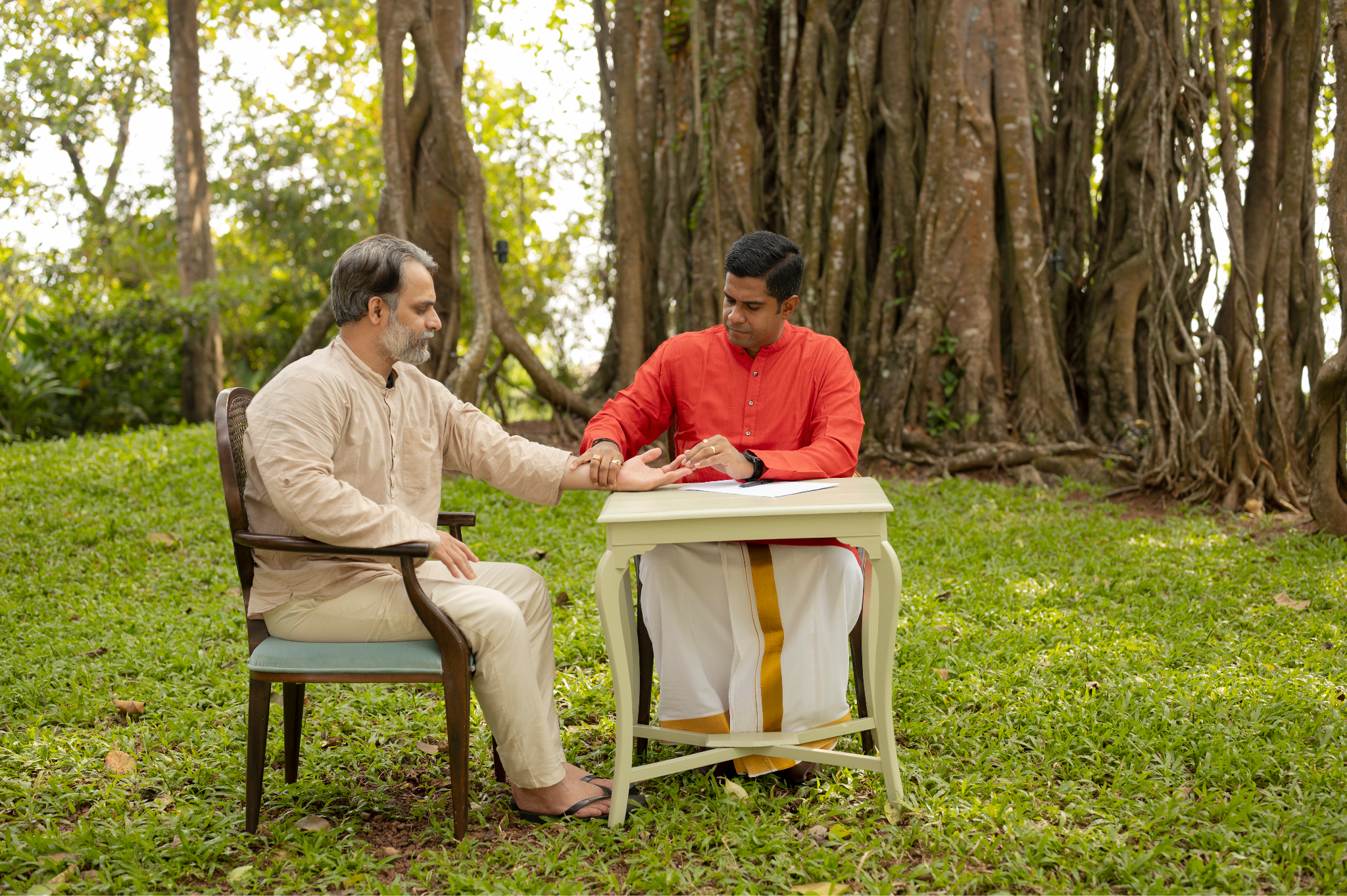 Dr. Vignesh Devraj seated in consultation